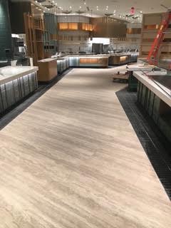 Hard Rock Hotel Buffet — tiled aisle between buffet counters with a red ladder