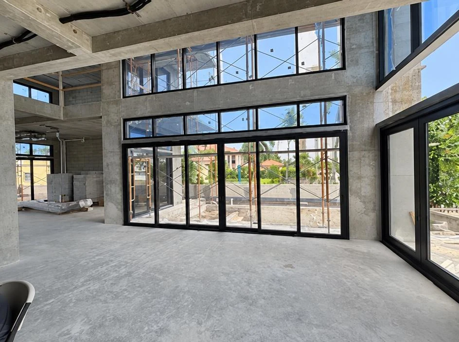 Custom Home — interior with glass doors and windows set during construction